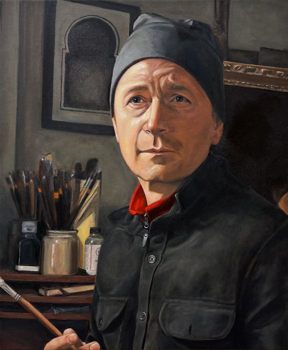 Oil painting of a man in a dark beanie and jacket holding a paintbrush, with brushes and jars on a shelf behind him.